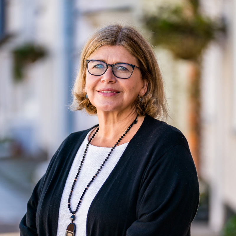 Nicky Mowat standing in the street near AJB Wealth's office in Alresford, Hampshire