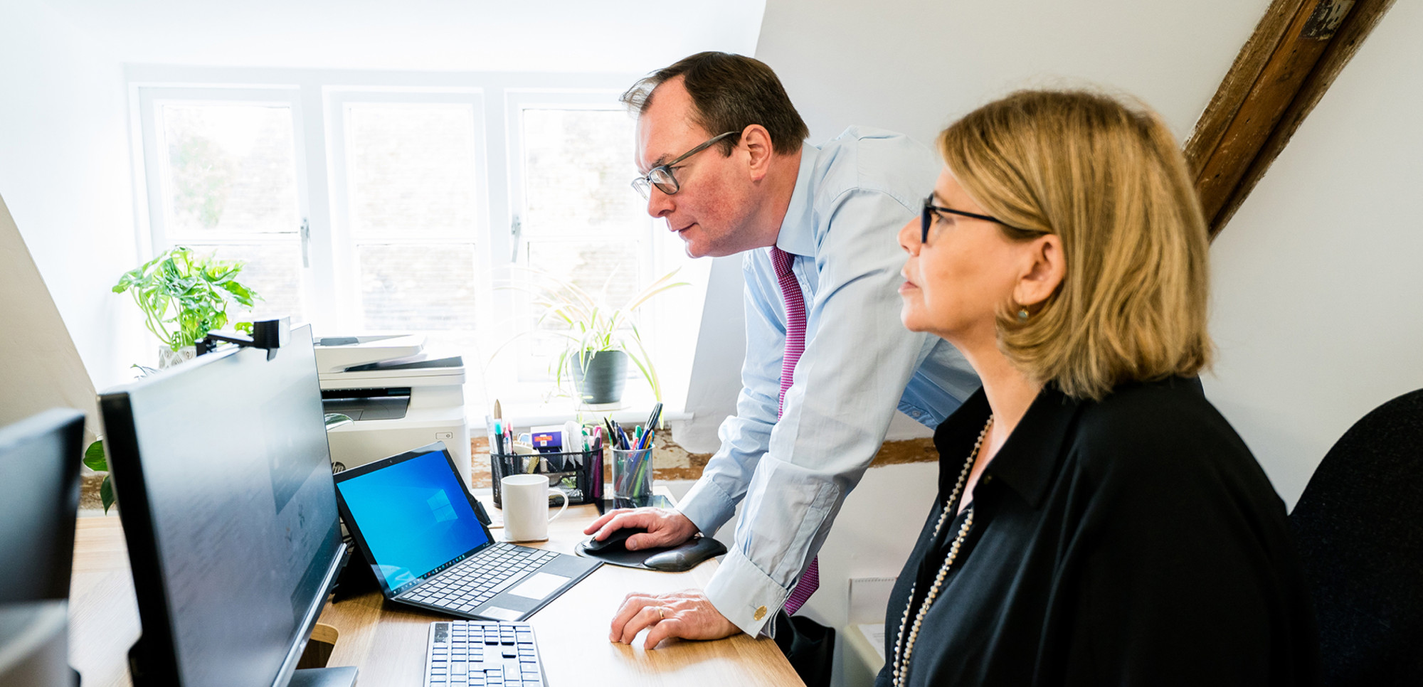 Paul Willans and Nicky Mowat from AJB Wealth in the Alresford office