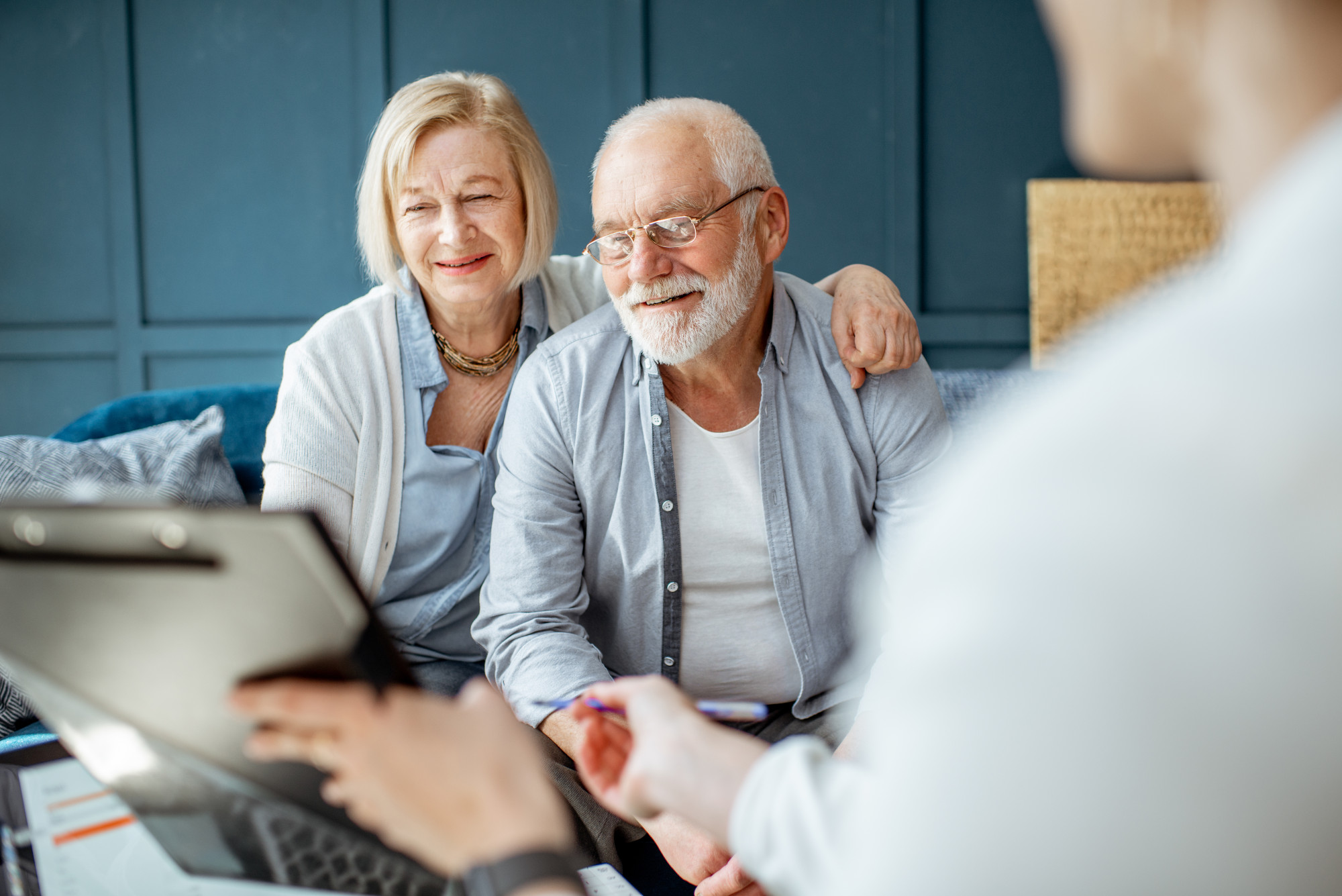 A couple talks to their investment advisor or wealth manager