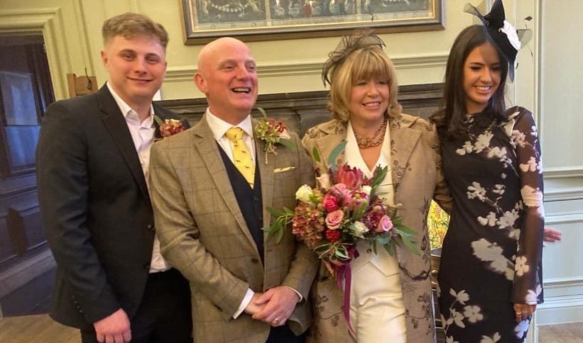 Nicky Mowat pictured on her wedding day with husband David and their children