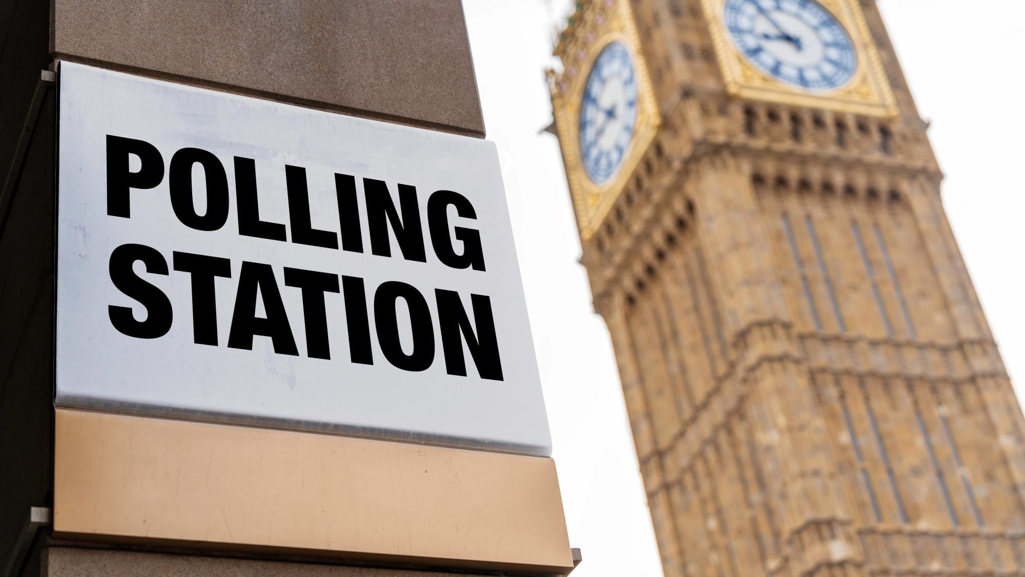 Manifestos compared: this image shows a polling station sign with London's Big Ben in the background