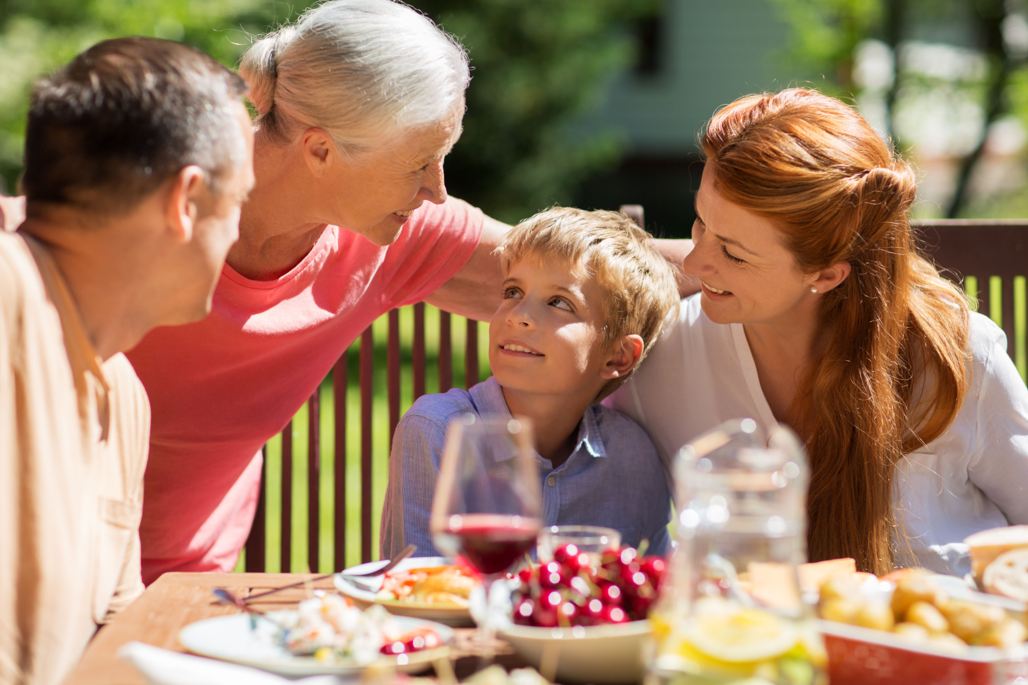 Three generations of a family enjoy quality time together, illustrating this article about reasons to talk about money with adult children