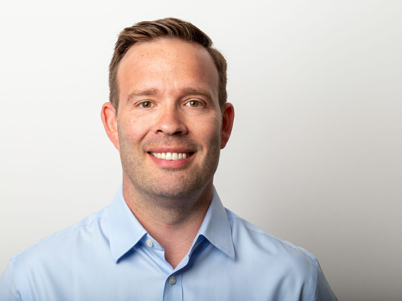 man smiling with white background