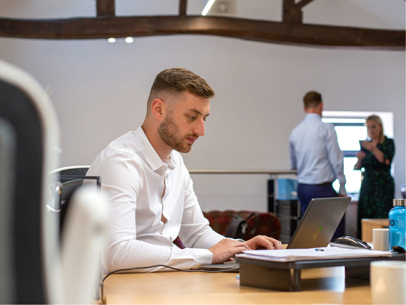 man using laptop at desk