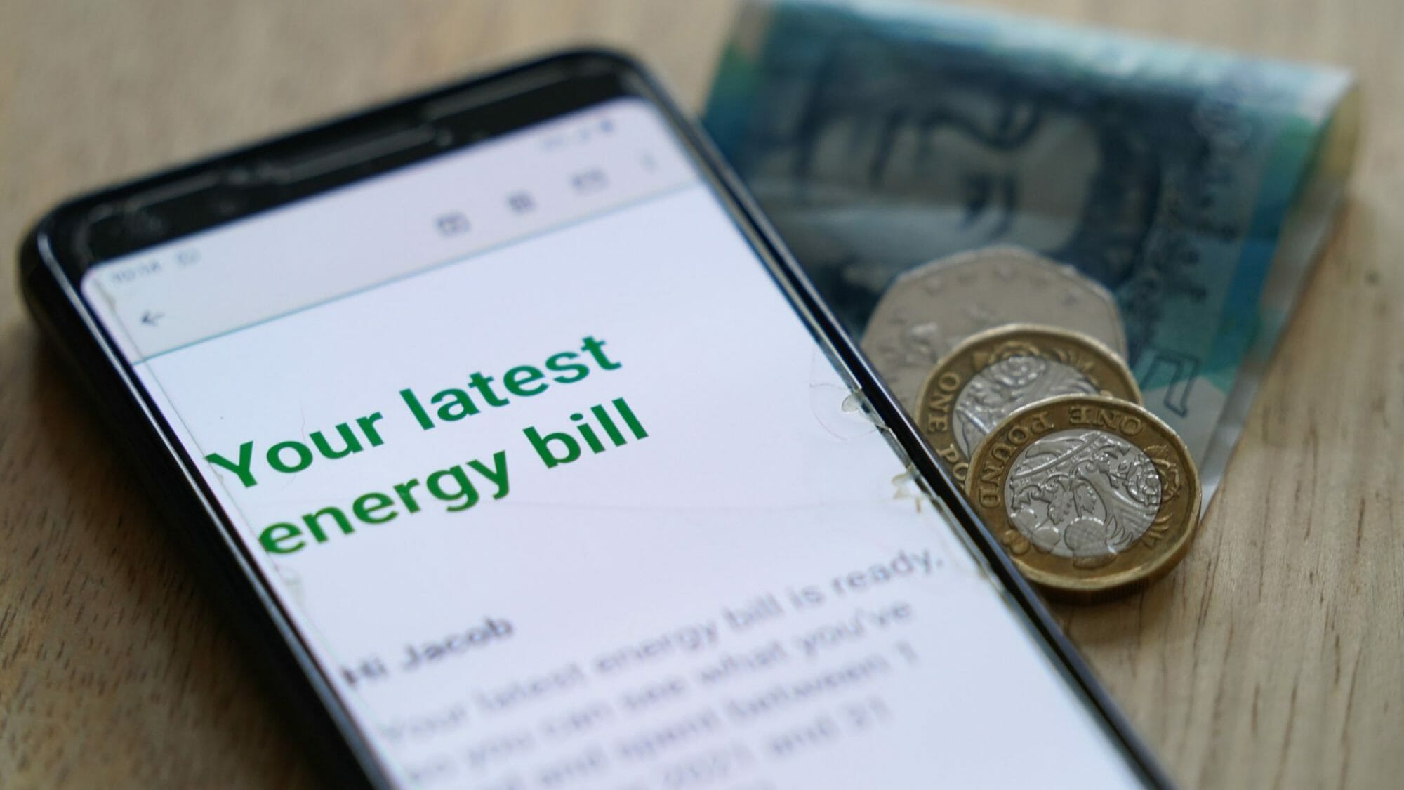 close up shot of energy bill on phone